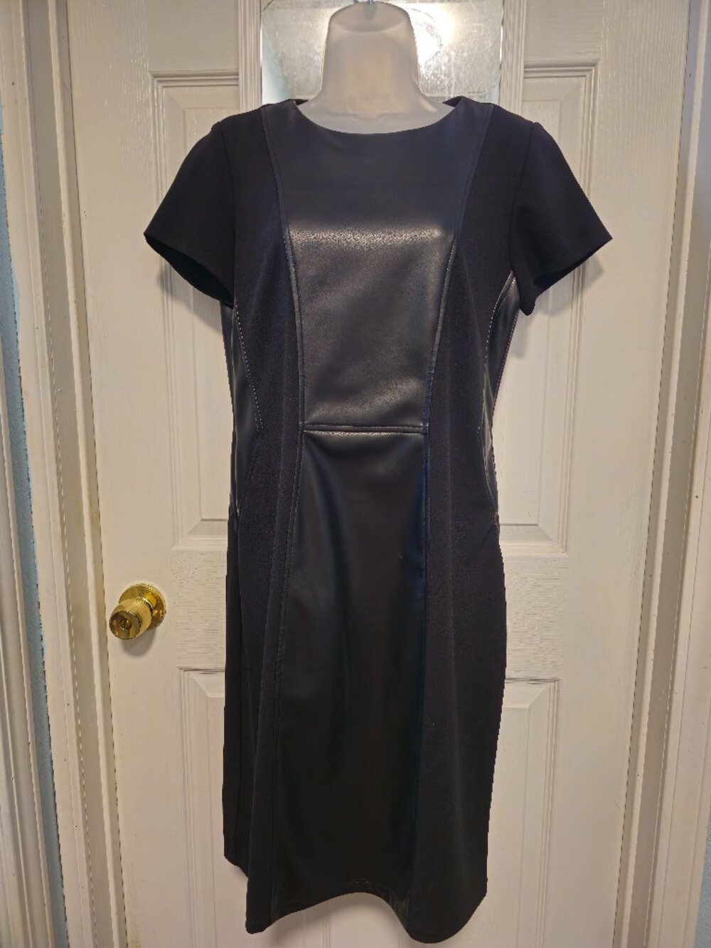 Two Little black dresses with leather inset